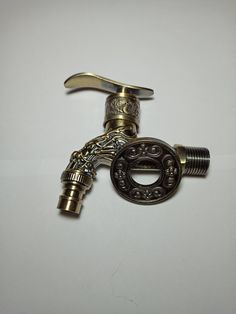 an old style faucet is shown on a white surface