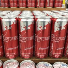 several cans of mountain dew on display in a store