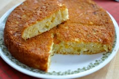 two pieces of cornbread on a white plate