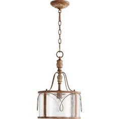 a light fixture with a glass shade hanging from it's center beam and chain