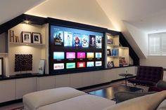 a large flat screen tv mounted to the side of a wall in a living room