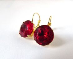 These earrings are a great addition to your jewelry arsenal! Inspired by paste glass earrings of the Georgian era, these also work flawlessly for everyday wear! I've used vintage Czech crystals in a rich Ruby red and set them in high-quality cast-brass settings which have been plated in your choice of Gold, Silver, or Antique Gold or Silver. These have strong lever backs so you don't need to worry about them coming undone or slipping out of your ears. The stones themselves are 14mm (about half a Classic Red Earrings For Party, Gift Red Round Crystal Earrings, Classic Red Party Earrings, Jewelry 18th Century, Marquise Earrings, Georgian Era, Historical Jewellery, Ruby Crystal, Jewelry Showcases