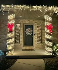 the front door is decorated with christmas lights and wreaths