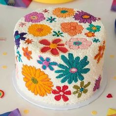 a decorated cake sitting on top of a table