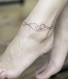 a woman's foot with a small tattoo on the side of her left leg