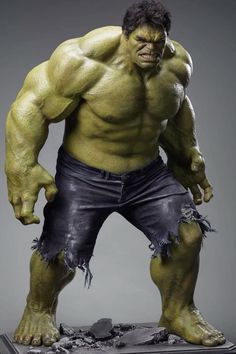 the incredible hulk statue is displayed in front of a gray background and it looks like he has