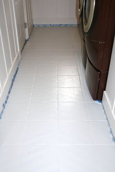 a washer and dryer sitting in a room next to each other on the floor