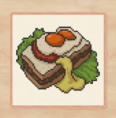 a cross stitch picture with food on it