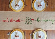 the place setting is ready to be served at this christmas dinner table set with white plates and silverware