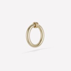 The Sirius Max Ring emphasizes circular simplicity by pairing a thick gauge, full round band of 18k gold or .925 sterling silver with three annulets in a variety of metals and configurations. A minimal but bold adornment, the Sirius Max Ring highlights Spinelli Kilcollin's focus on versatility and can be worn as a ring and as a pendant. Classic Hoop Rings With Spring Ring Clasp, Modern Hoop Rings Tarnish Resistant, Timeless White Gold Hoop Rings, Tarnish Resistant White Gold Hoop Ring, Yellow Gold Circular Jewelry With Ring Detail, Yellow Gold Hoop Rings With Polished Finish, Linked Rings, Galaxy Ring, Linking Rings