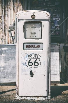 an old gas pump with the number 66 on it