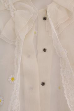 Dolce & Gabbana Gorgeous brand new with tags, 100% Authentic DOLCE & GABBANA white with daisy applique silk shirt blouse. Model: Long sleeve blouse shirt Collection: SICILY Color: White with yellow daisy Front button closure and button cuff Logo details Made in Italy Material: 100% Silk Daisy Applique, Silk Shirt Blouses, White Silk Blouse, Yellow Daisy, Sheer Shirt, White Daisy, Italian Luxury, White Silk, Dolce & Gabbana