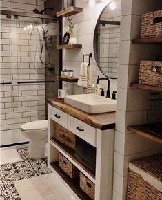 a bathroom with a sink, toilet and shelves