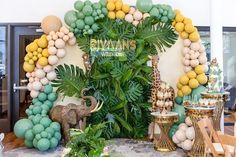 an elephant and giraffe themed party with balloons