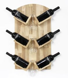 a wooden wine rack with six bottles on it and two empty glasses in the middle