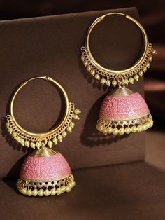 These beautiful pink & gold toned hoop jhumka earrings come with kundan stone studs & beads, are gold-plated, and are secured with a circular twist closure. These handcrafted jhumkas can be paired with any traditional outfit to add a punch of colorful boost, and help you stand out. Product color may vary based on the monitor or screen you are using.See FAQ for more details. Size Length: 7.5 cm Details Material: BrassStones: Kundan & Artificial BeadsPlating: Gold-plated Hoop Jhumka Earrings, Hoop Jhumka, Silver Jhumka Earrings, Indian Wedding Jewelry Sets, Traditional Outfit, Fancy Jewellery Designs, Traditional Earrings, Indian Wedding Jewelry, Fancy Jewellery