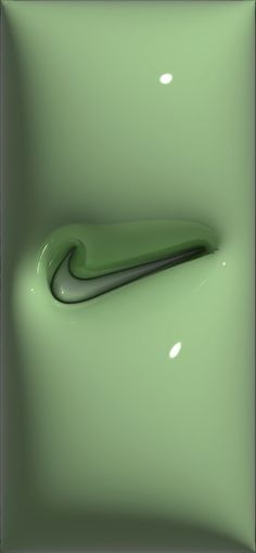 an abstract photograph of a green object in the shape of a curved tube on a light green background