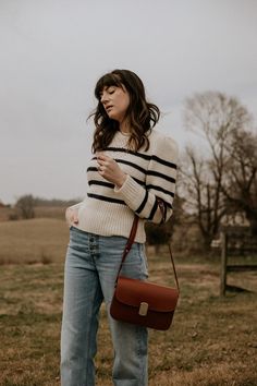 Sézane Essentials: What to Buy from this Popular French Fashion Brand - Jeans and a Teacup Sezane Milo Classic Bag, Milo Bag Sezane, Sezane Milo Bag, Striped Knit Sweater Outfit, Jojo Fashion, Tomboy Shirts, Knit Sweater Outfit, Striped Knit Sweater, Timeless Outfits