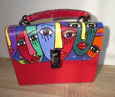 "A hand painted faux leather handbag with image of faces or can be masks in style avant-garde ( cubism) Painted by me using special fabric paints which are weather proof.  Size of the bag is : L- 23 cm( 9\"), H- 18 cm (7,2\"), D- 7,5 cm (3\"). The bag has top handle and long strap, inside there are two compartments (one with zip).  I can personalize the bag with your name in gold or silver metallic paint for an extra cost. All bags will be supplied with a certificate of authenticity ." Trendy Rectangular Hand Painted Bags, Artsy Hand Painted Shoulder Bag For Daily Use, Artistic Red Rectangular Bag, Red Hand Painted Bags, Artsy Hand Painted Rectangular Shoulder Bag, Artistic Hand Painted Crossbody Shoulder Bag, Artistic Hand Painted Satchel Shoulder Bag, Artistic Hand-painted Satchel Shoulder Bag, Leather Painting