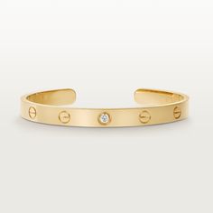 Cartier - LOVE bracelet, 1 diamond - Bracelet Gold/Diamond - LOVE bracelet, 18K yellow gold (750/1000), set with 1 brilliant-cut diamond totaling 0.10 carats. Width: 6.1 mm (for size 17). Please note that the carat weight, number of stones and product dimensions will vary based on the size of the creation you order. For detailed information please contact us. Gold Diamond Watches, Cartier Earrings, Cartier Necklace, Luxury Bracelet, Bracelet Love, Bracelets Gold Diamond, Love Bracelet, Cartier Love, Rose Gold Jewelry