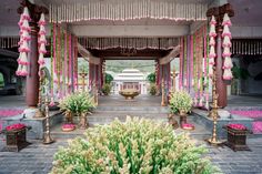 an outdoor wedding venue with pink and gold decorations