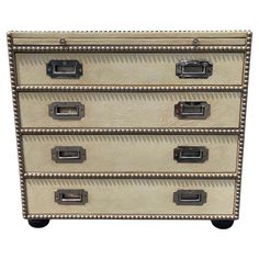 an old chest of drawers with metal handles and rivets on the sides, isolated against a white background