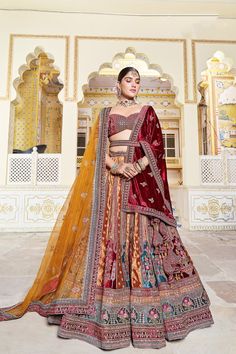 This Lehenga Choli is Ready to Wear A stunning lehenga with beautiful Heavy Sequins, diamond and Zari work, dupatta and lehenga, designed especially for wedding season. Type : Bridal Lehenga Choli Style : A-Line Occasion: Festival Wear, occasion Wear, Party wear Festival: Diwali, Navratri, Pongal, Ugadi etc. Color: Lehenga – Mustard & Blue Color, Blouse – Maroon Color, Dupatta – Mustard & Maroon Color Fabric : Lehenga – Velvet, Blouse – Velvet, Dupatta – Net & Velvet. Work: Lehenga – Sequins, di Multicolor Motif Lehenga For Wedding, Multicolor Motifs Lehenga For Wedding, Traditional Drape Lehenga With Meenakari For Designer Wear, Semi-stitched Multicolor Lehenga With Motifs, Multicolor Semi-stitched Lehenga With Motifs, Semi-stitched Bollywood Lehenga With Motifs, Semi-stitched Meenakari Sets For Reception, Bollywood Semi-stitched Lehenga With Motifs, Kundan Lehenga With Motifs For Navratri