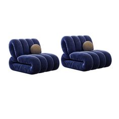 a pair of blue velvet lounge chairs with gold buttons on the armrests and back cushions