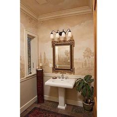 a bathroom with a sink, mirror and rug on the floor in front of it