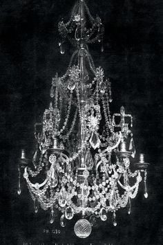 an old chandelier is shown in black and white