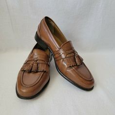 Florsheim Cognac Naples Kiltie Tassel Moc Dress Loafer Size Mens 9.5 D Model 18498 03 Pre-owned, good condition. Does NOT include original box. As always please see photos for details of the exact item you're buying. My items are sold as is and no returns. I take pride in providing quality photos with a quality description to ensure no returns or confusion. If you have any questions just ask!! Formal Wingtip Oxfords With Tassels, Classic Brown Dress Shoes With Tassels, Formal Brown Dress Shoes With Tassels, Classic Brown Tassel Loafers For Formal Occasions, Vintage Brown Tassel Loafers For Work, Vintage Brown Loafers For Office, Elegant Formal Fitted Tassel Loafers, Classic Formal Tassel Loafers With Moc Toe, Brown Moc Toe Tassel Loafers For Office