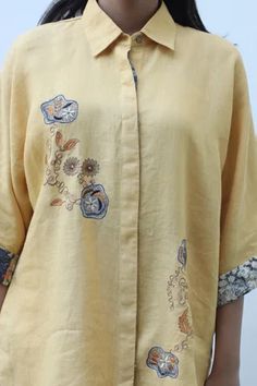 Shop for Linen Bloom Yellow Floral Embroidered Linen Shirt for Women Online at Aza Fashions Spring Yellow Tops With Resham Embroidery, Yellow Resham Embroidery Top For Spring, Embroidered Linen Tops With Relaxed Fit, Short Sleeve Cotton Kurta With Floral Embroidery, Traditional Linen Shirt For Spring, Cotton Kurta With Floral Embroidery And Short Sleeve, Spring Yellow Tops With Printed Motifs, Yellow Summer Tops With Printed Motifs, Traditional Embroidered Linen Shirt