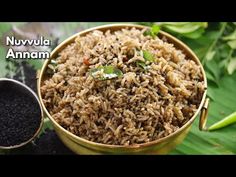 a bowl filled with brown rice next to a spoon and some green leafy plants