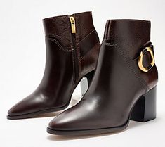 Punctuated with a sleek equestrian-style buckle, these chic leather ankle boots bring an edgy energy to any outfit (complete with an inside zipper for easy entry). From Vince Camuto. Formal Moto Boots With Buckle Closure For Fall, Workwear Boots With Buckle Closure, Chic Formal Ankle Moto Boots, Chic Formal Moto Ankle Boots, Leather Boots With Horsebit Detail For Work, Modern Ankle Moto Boots For Work, Elegant Pointed Toe Moto Boots For Work, Chic Heeled Boots With Buckle For Work, Luxury Moto Boots With Buckle Closure For Fall