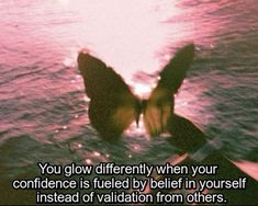 a butterfly flying over the water with a quote on it that says, you glow differently when