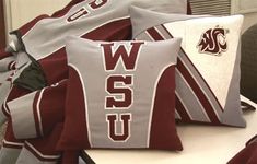 several pillows with the word wsu on them