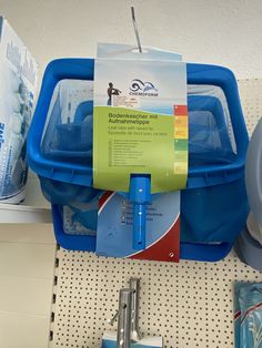 there is a blue container on the shelf