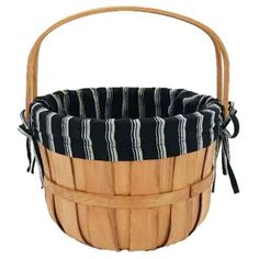 a wooden basket with black and white stripes