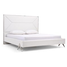 a white bed with an upholstered headboard and foot board on the side