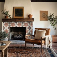 a living room filled with furniture and a fire place covered in potted plantes