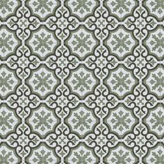 a green and white tile pattern with an intricate design on it's surface,