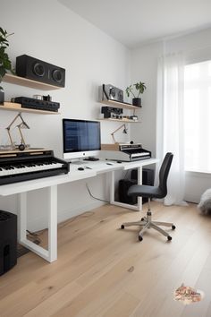 a white desk topped with two computer monitors next to a keyboard and mouse on top of a hard wood floor