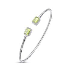 Luscious emerald-cut peridots are the stars of this eye-catching and stylish bangle bracelet, gleaming at either end of the open cuff design. Round white lab-created sapphires sparkle on each side. The bangle is crafted in sterling silver with a rhodium finish and chic rope texturing. Elegant Green Stackable Bracelets, Modern Green Bangle Jewelry, Green Sterling Silver Cuff Bracelet For Gift, Sterling Silver Open Cuff Bangle For Gift, Elegant Green Bangle Cuff Bracelet, Modern Green Bangle, Elegant Green Rectangular Bracelet, Adjustable Elegant Lime Green Jewelry, Luxury Silver Open Cuff Bangle