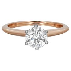 a rose gold engagement ring with a round brilliant diamond