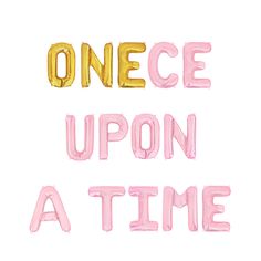 the words once upon a time are painted in gold and pink on a white background