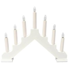 a white candle holder with eight candles on it