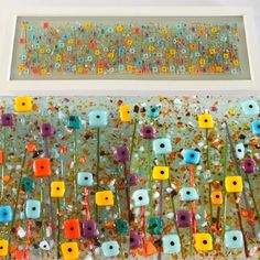 an art work with colorful flowers on it