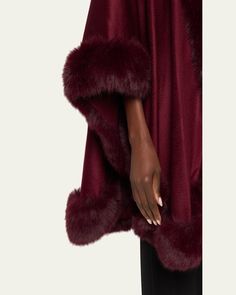 Sofia Cashmere cape in cashmere and faux fur (acrylic/polyester)    Open front     Side vents     Hem rests below hips     Imported Fall Poncho With Faux Fur Trim Cape, Elegant Fur Cape Coat For Fall, Winter Faux Fur Poncho With Trim, Winter Poncho With Faux Fur Trim, Elegant Faux Fur Cape Outerwear, Elegant Cape-style Fur Coat With Faux Fur Lining, Elegant Faux Fur Winter Cape, Elegant Faux Fur Cape For Fall, Elegant Faux Fur Cape