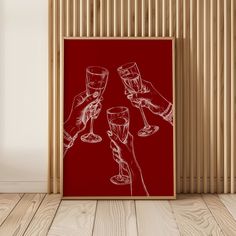 three wine glasses are being toasted in front of a red poster on the wall