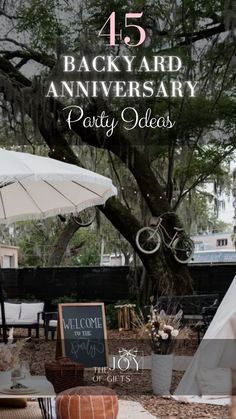 the back yard anniversary party ideas with an umbrella, chairs and tables in front of it